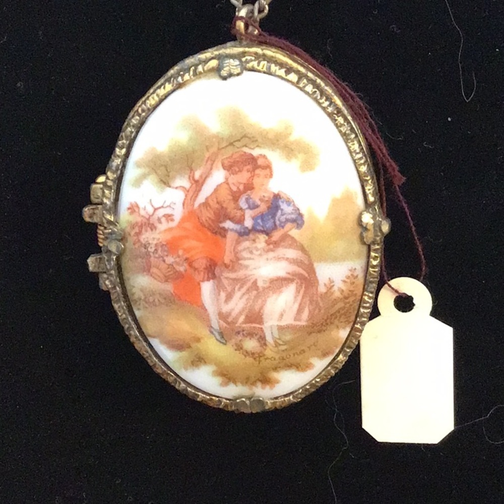 Spring loaded artist signed locket